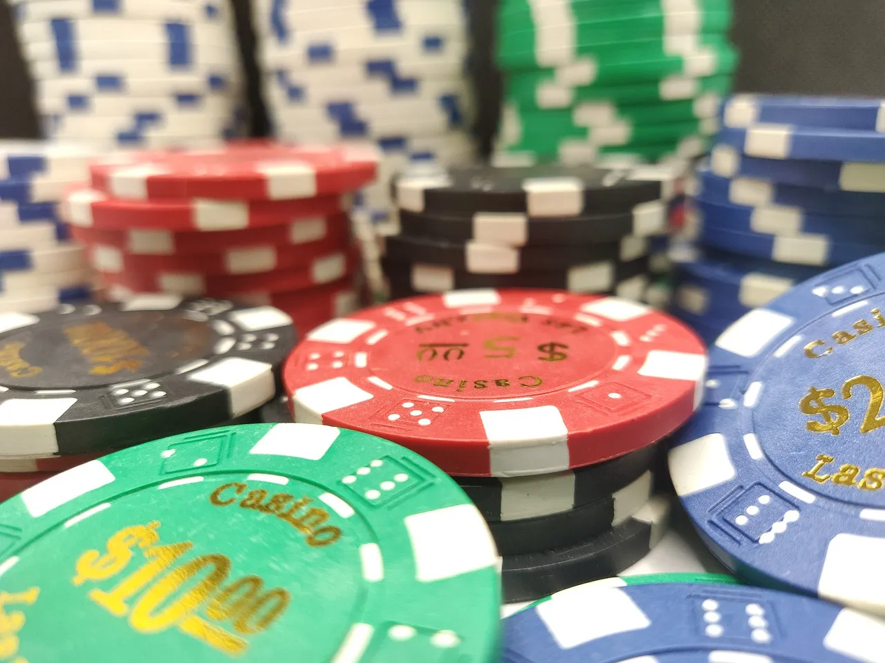Colorful casino chips stacked on gaming table